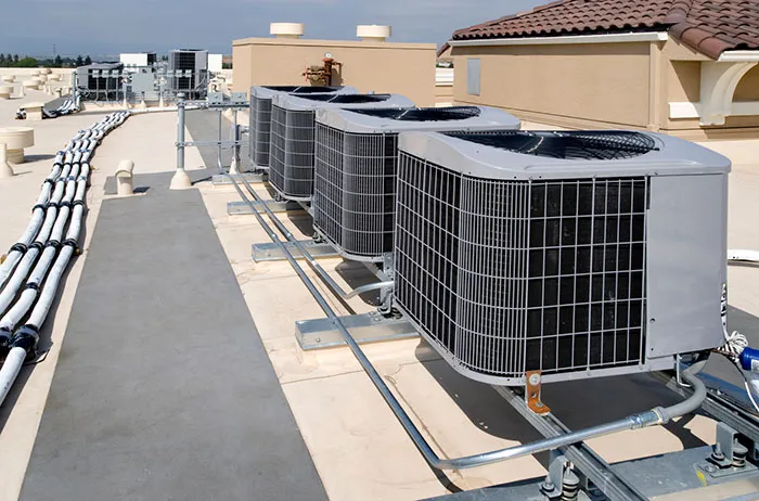 Rooftop HVAC system near ventilation fans